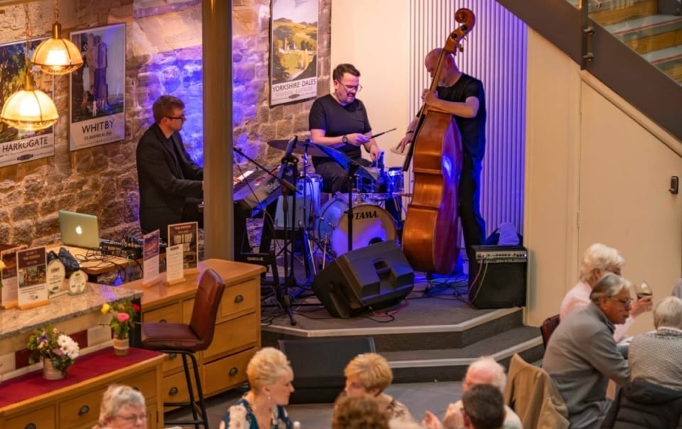 The Joseph Carville Trio Band performing near Masham